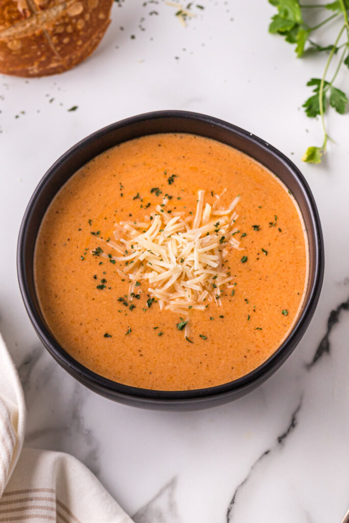 slow cooker tomato soup in black bowl
