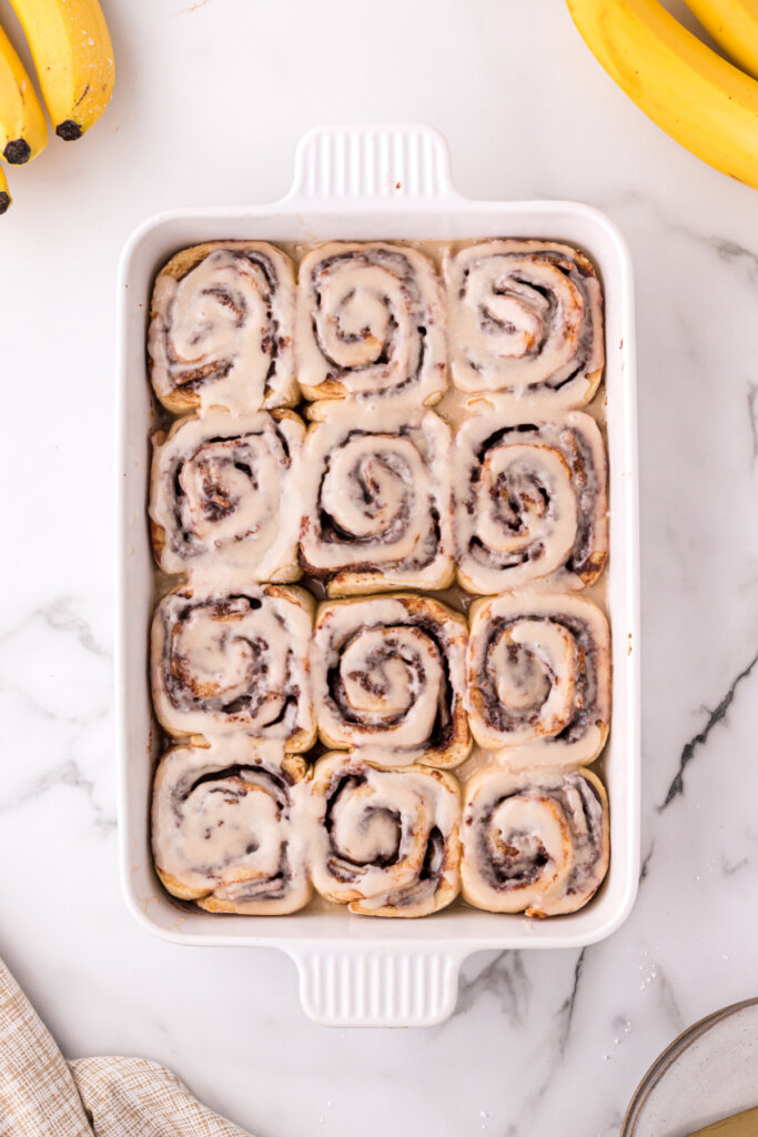 frosted nutella cinnamon rolls in pan