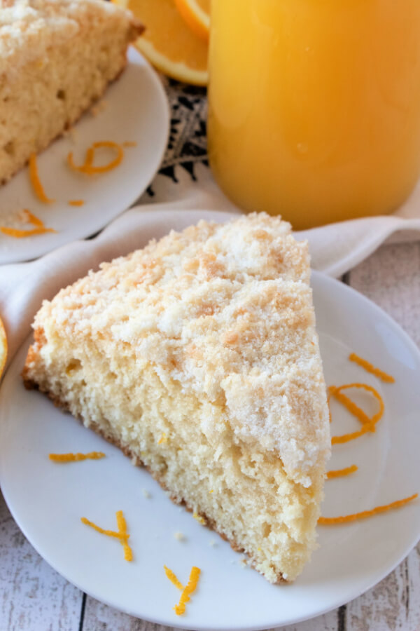 orange streusel coffee cake slice on plate