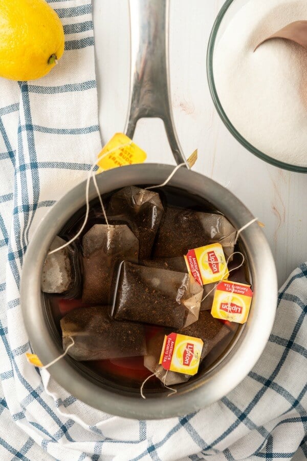 tea bags steeping in a pot of water