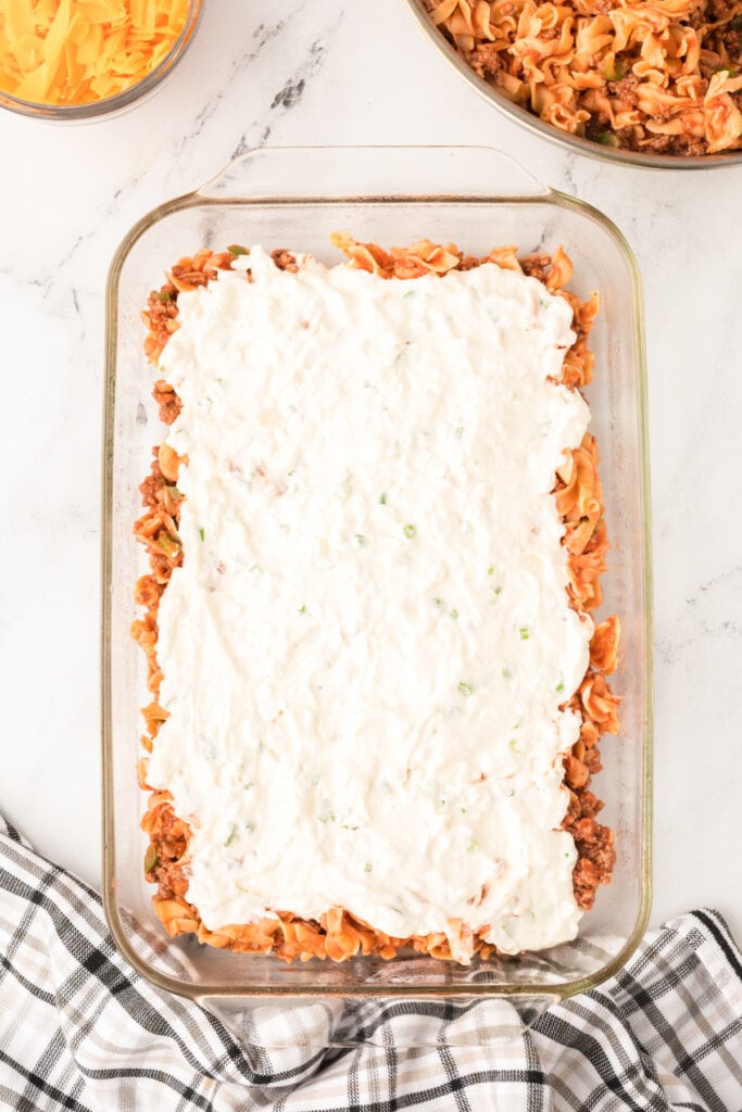 creamy cottage cheese mixture spread over the noodle layer in baking dish