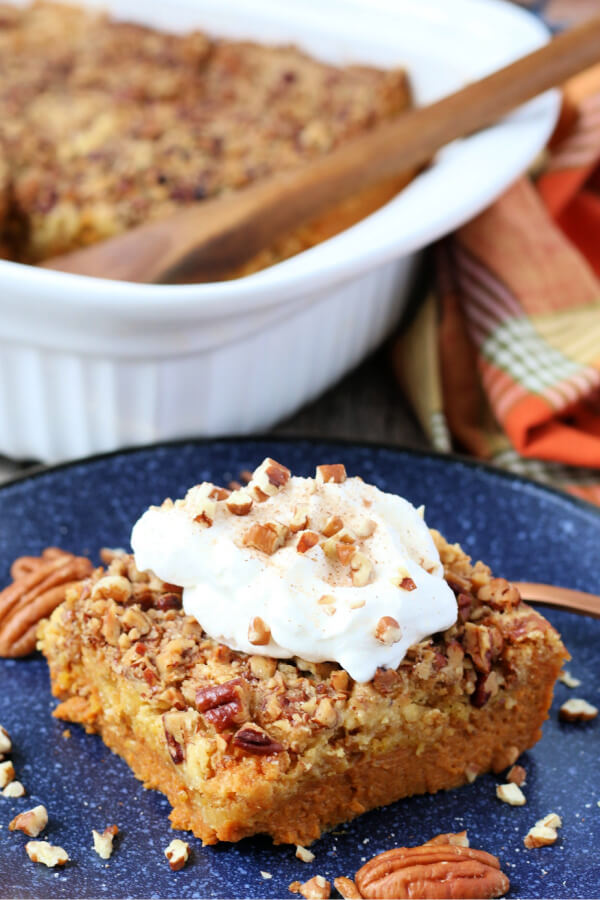 pumpkin dump cake slice on blue plate