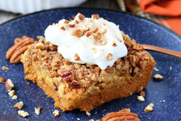 finished pumpkin dump cake slice on blue plate