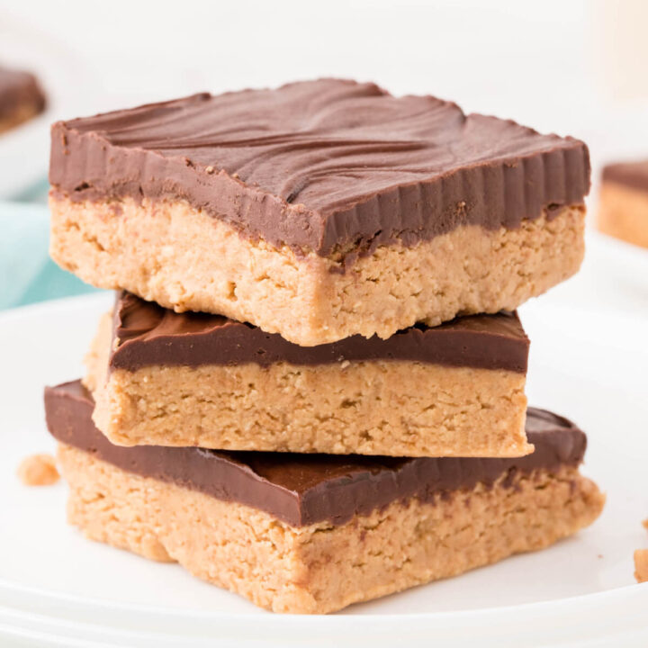 three chocolate peanut butter bars stacked on each other