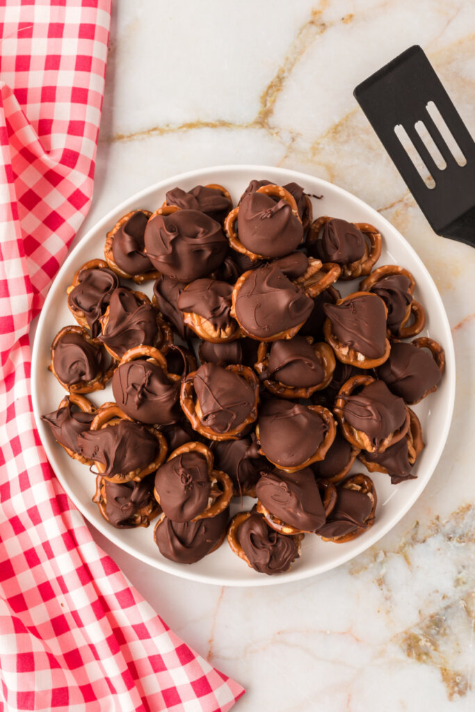 looking down onto a platter filled with chocolate turtle candy