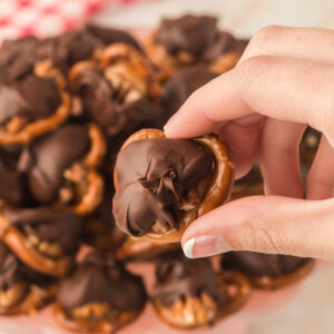 hand holding chocolate trurtle candy