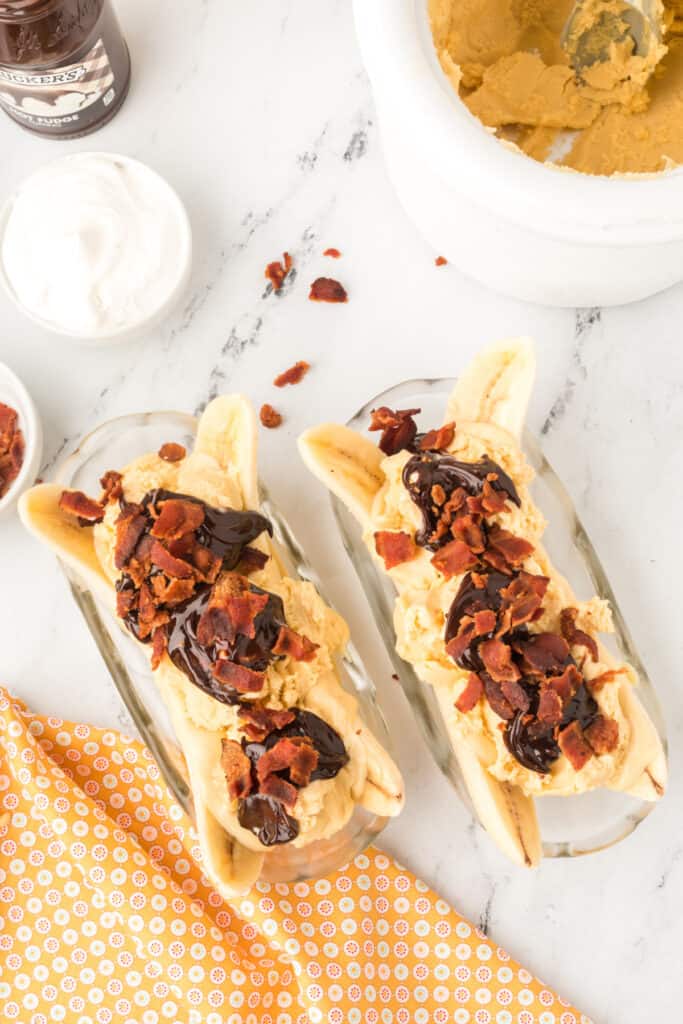 Crispy crumbled bacon sprinkled over hot fudge on an Elvis Banana Split.