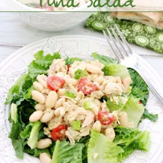 Mediterranean Tuna Salad on a white plate with a fork.