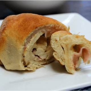 Chicken Cordon Bleu Crescent Rolls on a white plate.