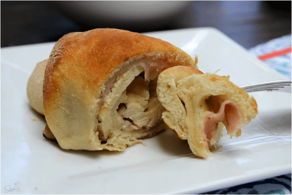 Chicken Cordon Bleu Crescent Rolls on a white plate.