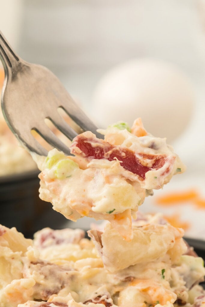 bite of bacon ranch potato salad on fork