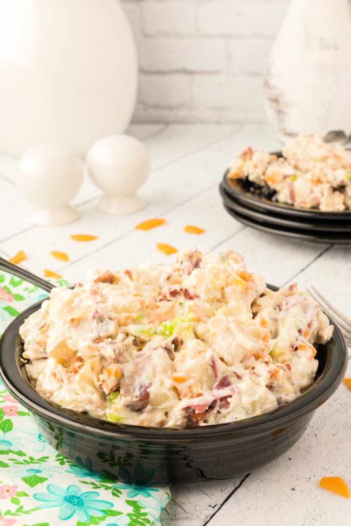 bacon ranch potato sald in bowl with spoon