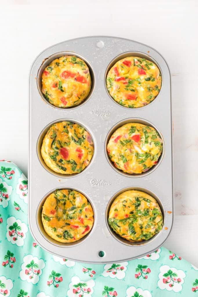 Baked Breakfast Egg Muffins in a muffin pan fresh from the oven