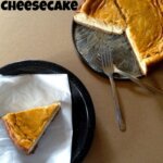 Pumpkin Layer Cheesecake on a plate with two forks.