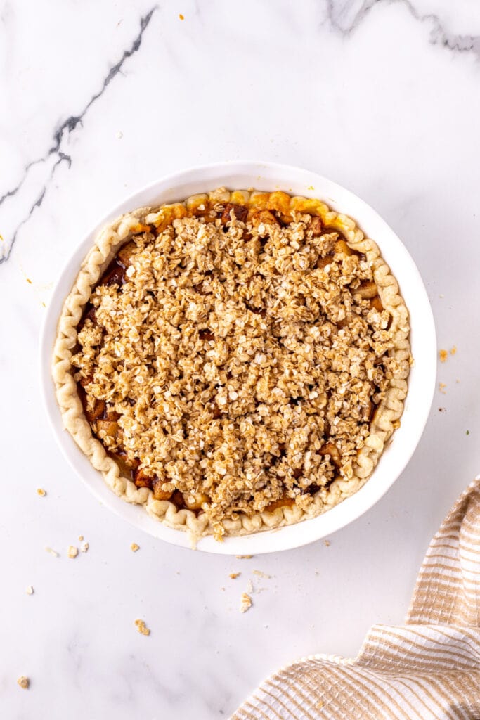Unbaked crisp topping added over the apple layer in the pie crust before baking.