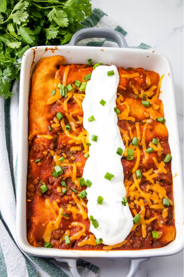 finished ground beef enchiladas in pan