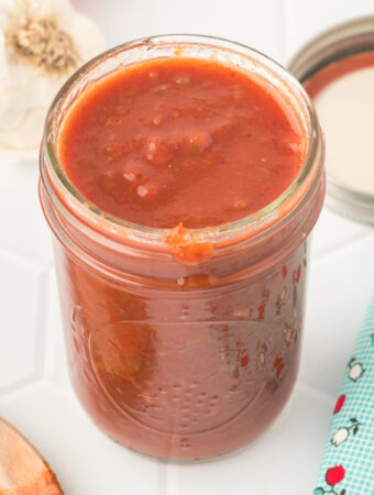 homemade enchlada sauce in glass jar