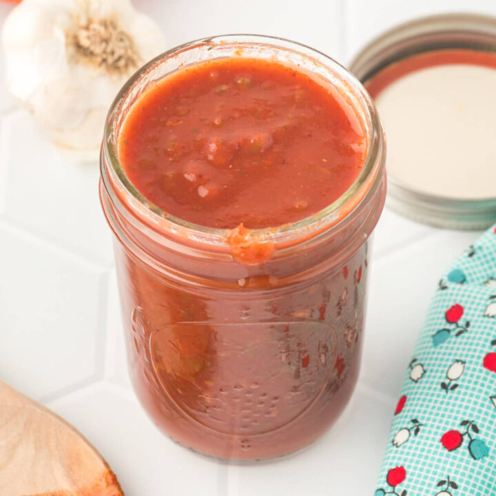 homemade enchlada sauce in glass jar