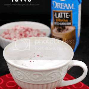 Dairy-Free Peppermint Mocha Latte in a cup with pieces of candy cane.