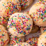 Square crop of glazed Italian Ricotta Cookies with colorful sprinkles