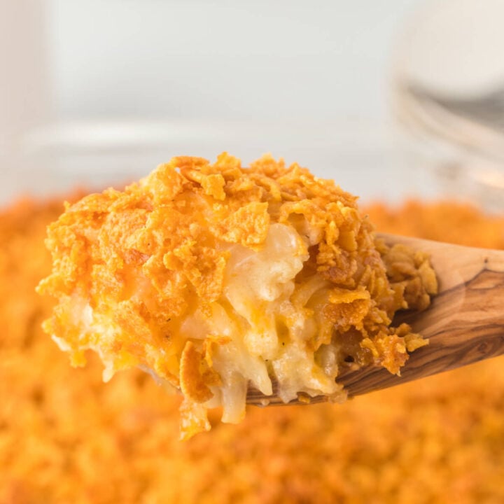 hash brown casserole scoop on wooden spoon