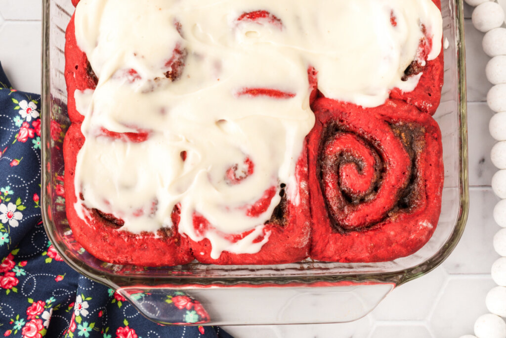 red velvet cinnamon rolls in pan