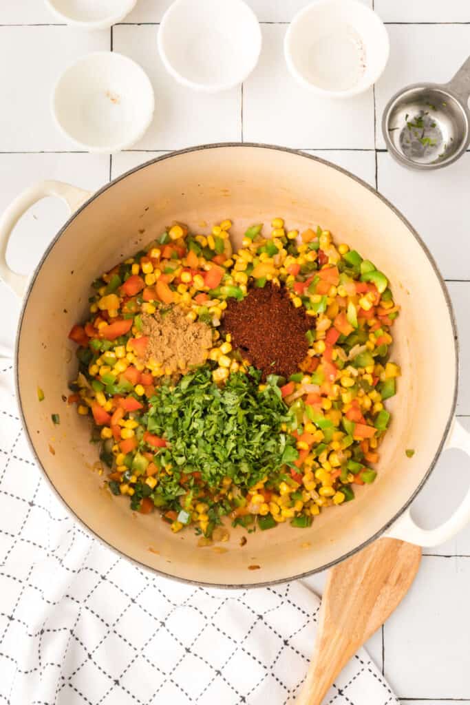 seasoned vegetable mixture cooking in pot for vegetarian enchilada quinoa casserole