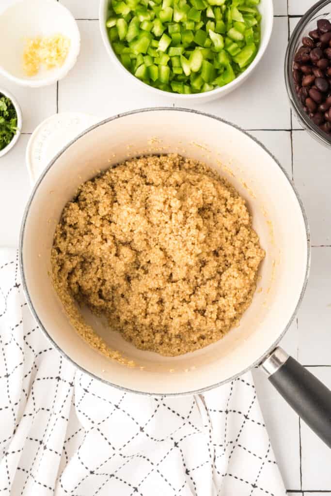 cooked quinoa in a saucepan ready for vegetarian enchilada quinoa casserole
