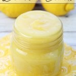 lemon curd in jar with lemons in background