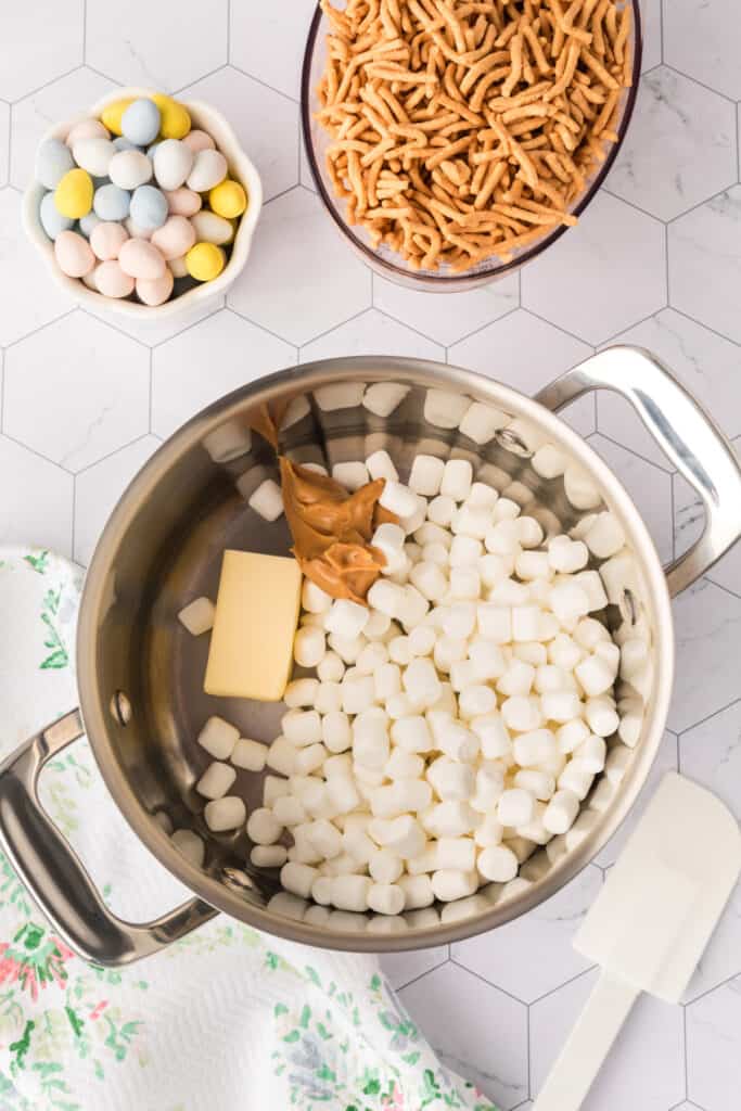 butter, peanut butter, and marshmallows in pot before being melted