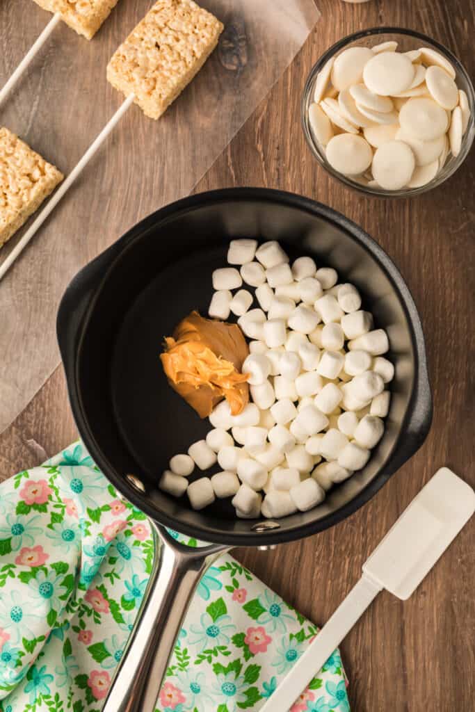 marshmallows and peanut butter in saucepan before being melted