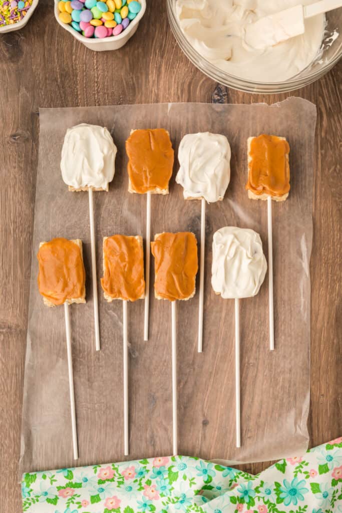 three of the eight pops coated with white candy melts
