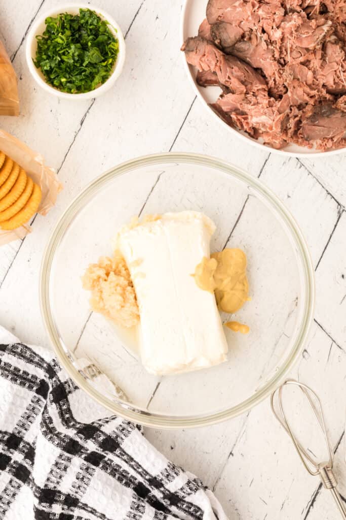 cream cheesem Dijon, and horseradish in bowl. 