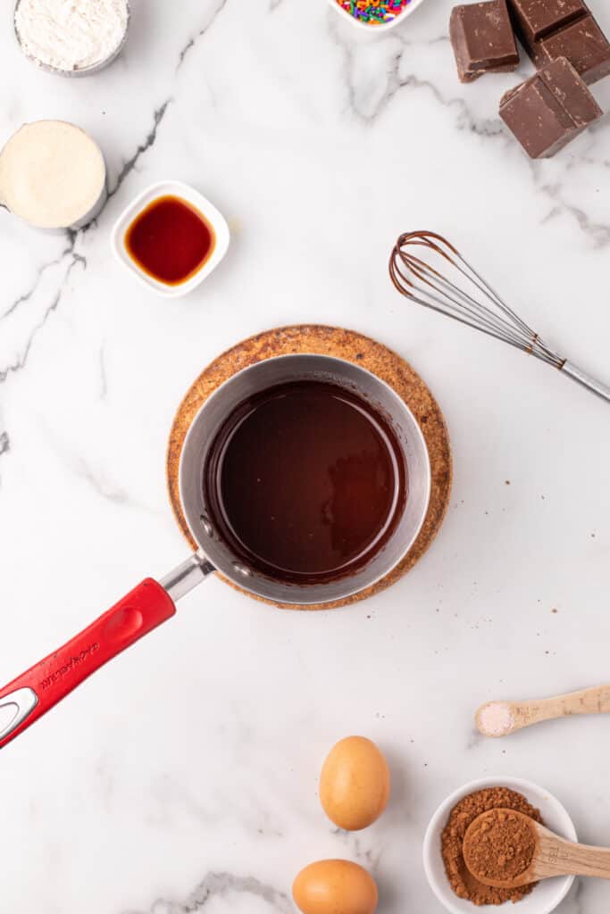 Melted chocolate and butter whisked together until smooth for homemade chocolate taco shells.