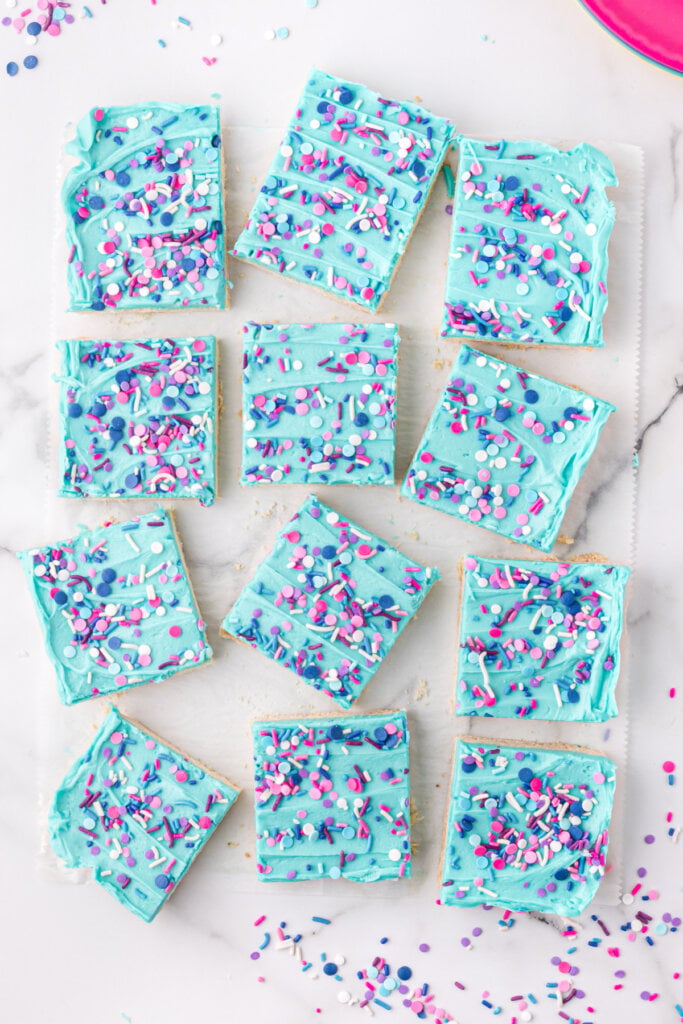 looking down onto frosted sugar cookie bars cut into squares
