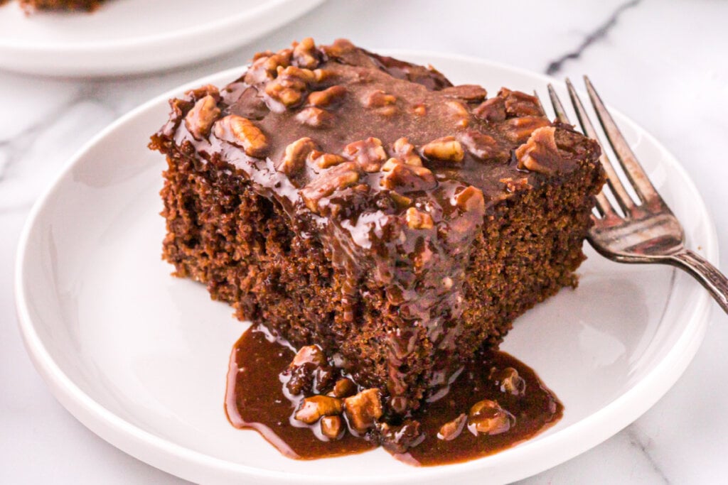 slice of coca cola cake on white plate