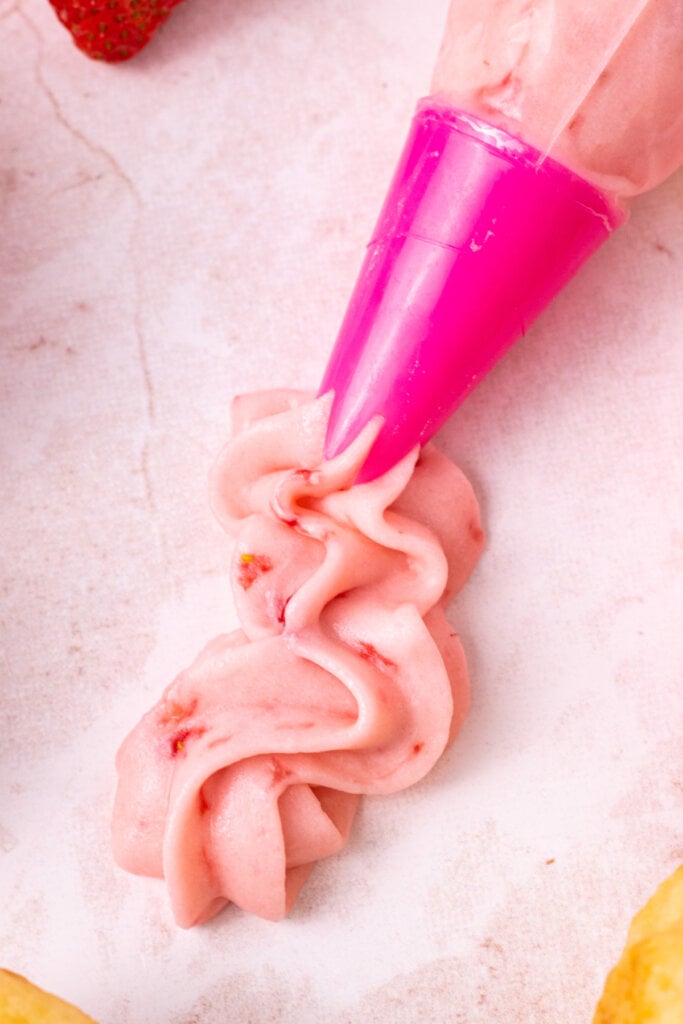 frosting piped into a squiggle on table