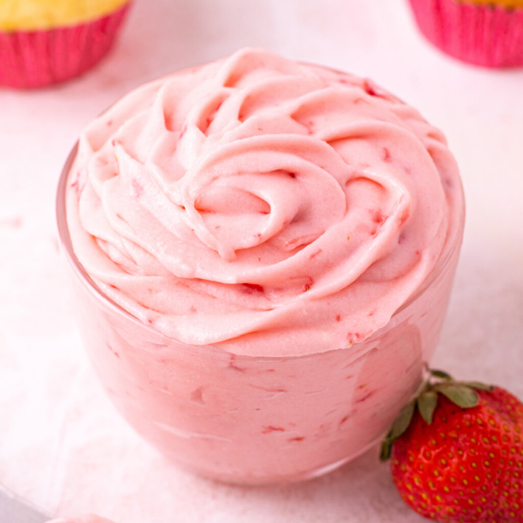 fresh strawberry buttercream frosting in a glass jar