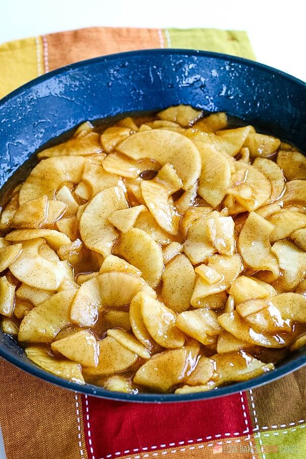 Cooked apples in a skillet.