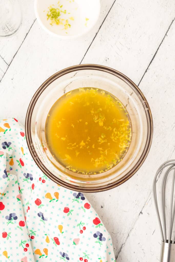 Whisk together the fruit juices and lime zest. 