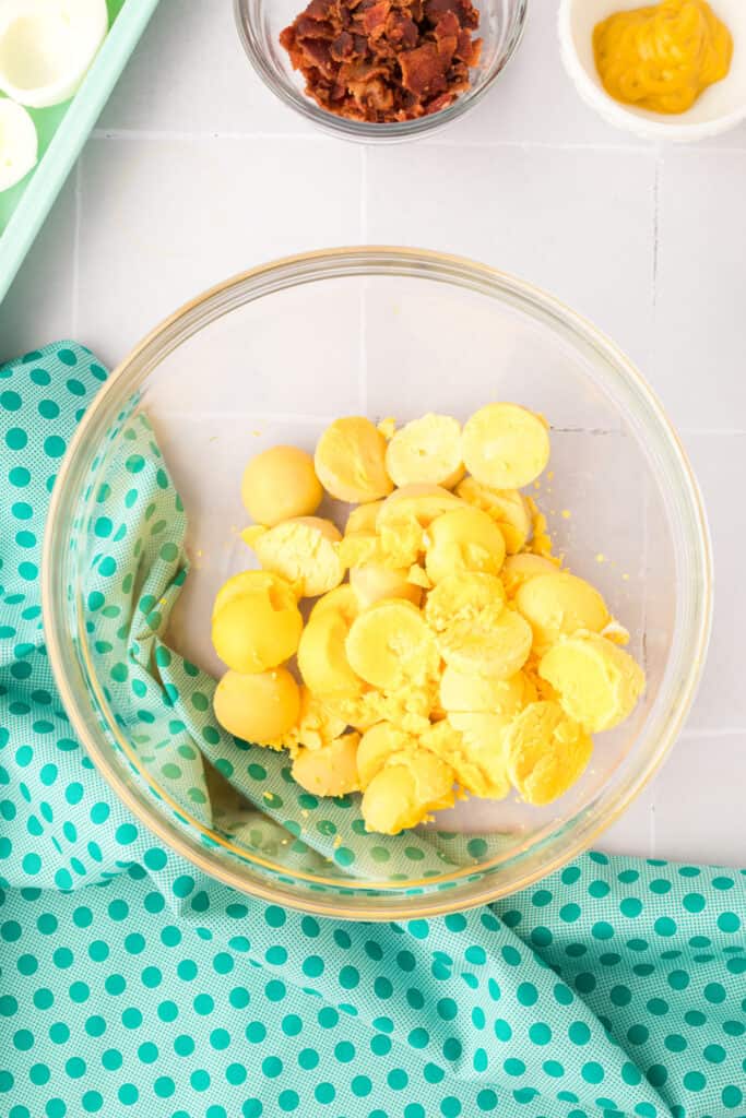 Remove yolks to a small bowl. 