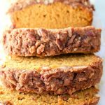 Pumpkin Streusel Coffee Cake Bread sliced on a cutting board.