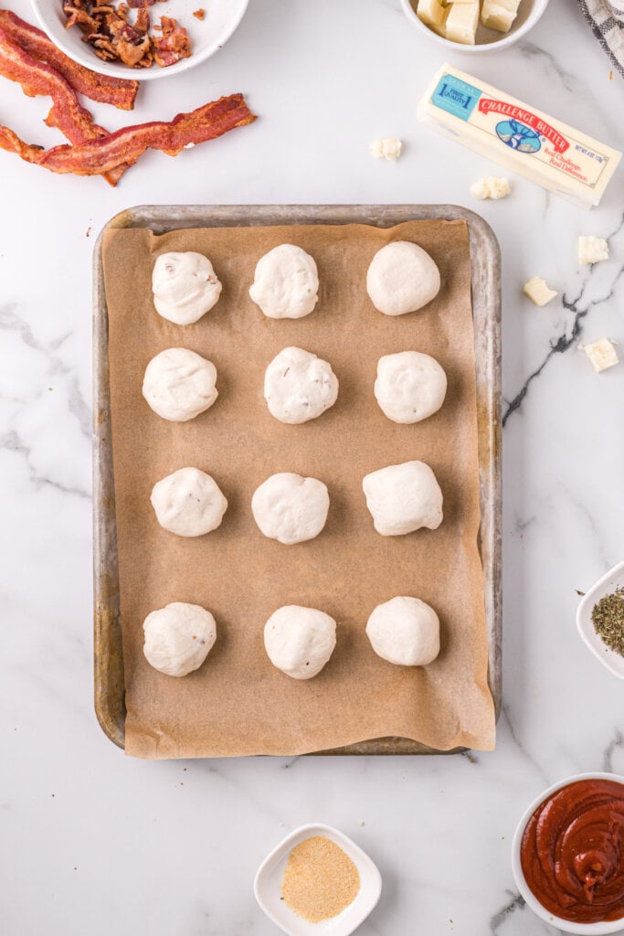 place the biscuit bombs on a baking sheet.