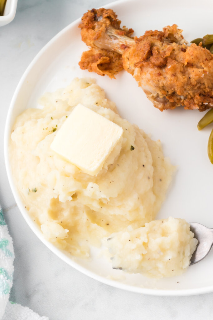 mashed potatoes on plate with fork