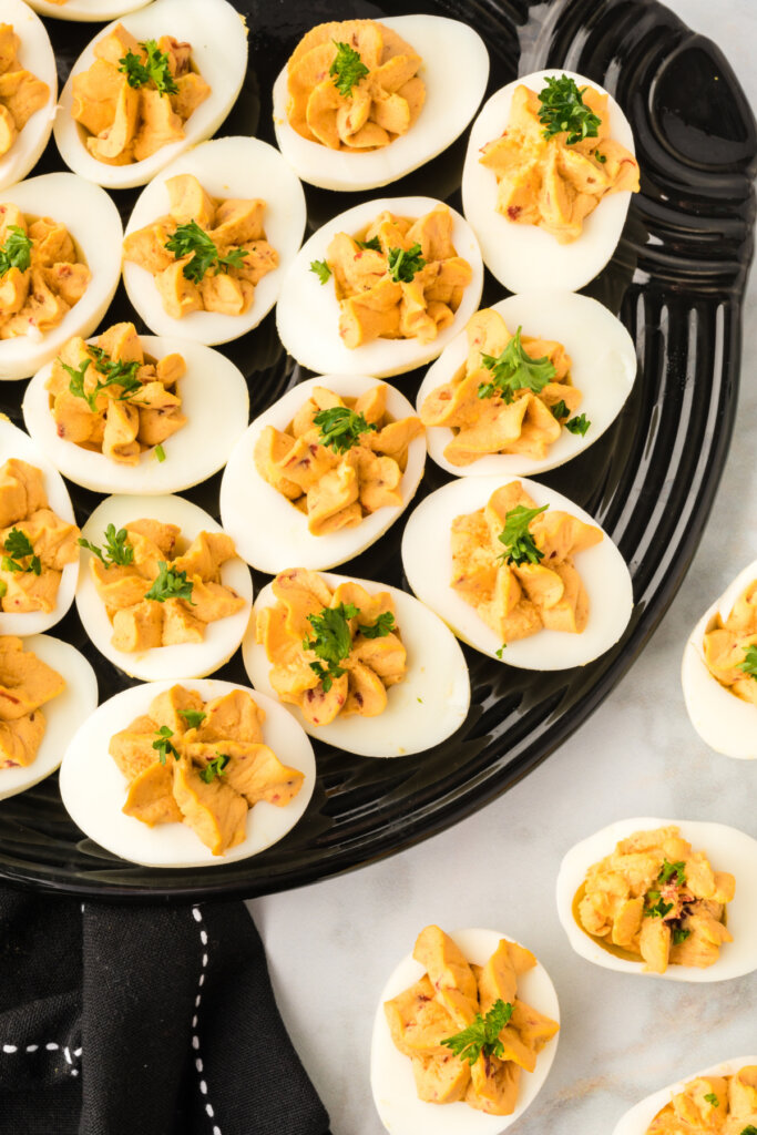 chipotle deviled eggs on black platter