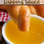 bread being dipped into Garlic Butter Dipping Sauce