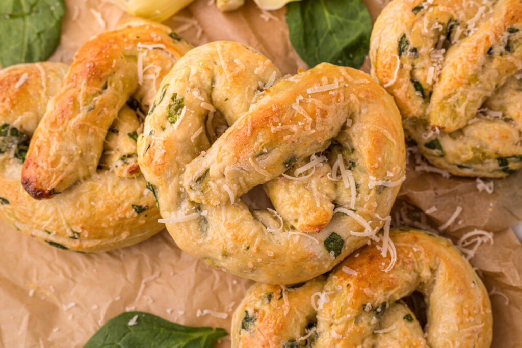 spinach artichoke pretzels on brown paper