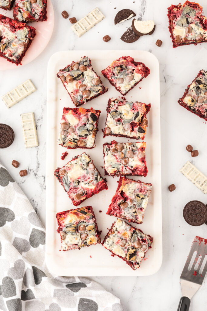 finished red velvet cookie bars on plate