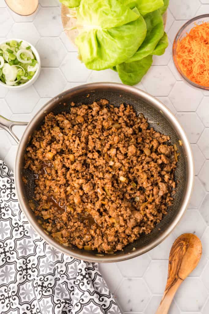 fully cooked seasoned ground pork filling in a skillet for Asian Pork Lettuce Wraps