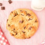 looking down onto a giant peanut butter cookie with chocolate chunks